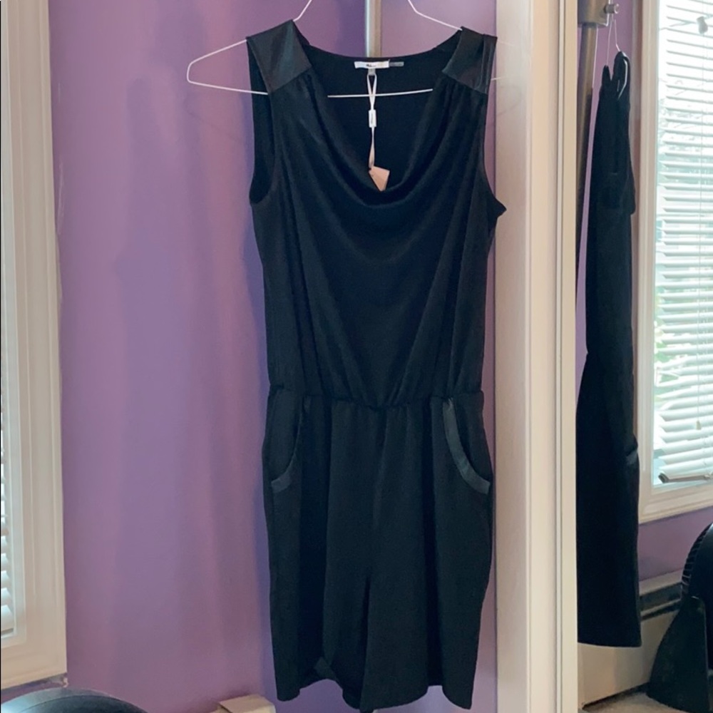 Black romper with leather details